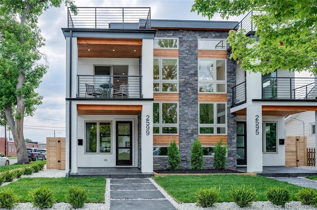 4474 Utica St, Denver, CO 80212 - contemporary house with a balcony and stone siding