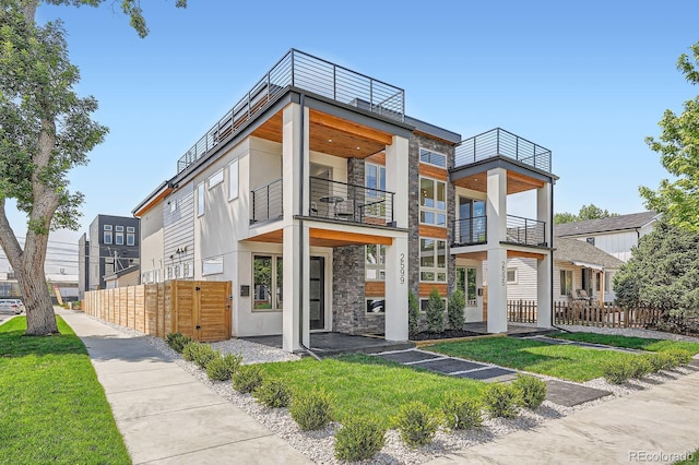 4474 Utica St, Denver, CO 80212 - contemporary house with stone siding, stucco siding, and a balcony