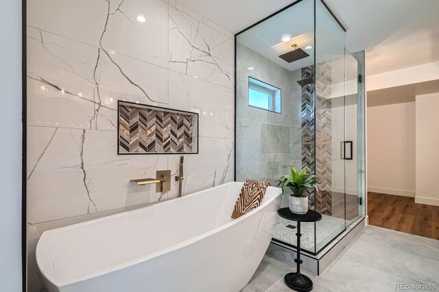 4474 Utica St, Denver, CO 80212 - full bath featuring a shower stall, a freestanding tub, and wood finished floors
