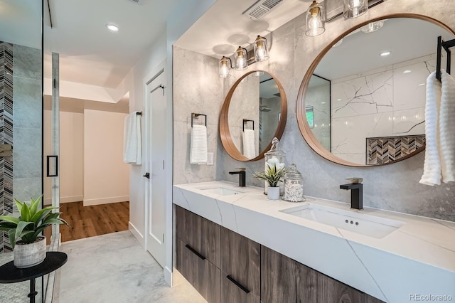 4474 Utica St, Denver, CO 80212 - bathroom featuring double vanity, tiled shower, and recessed lighting