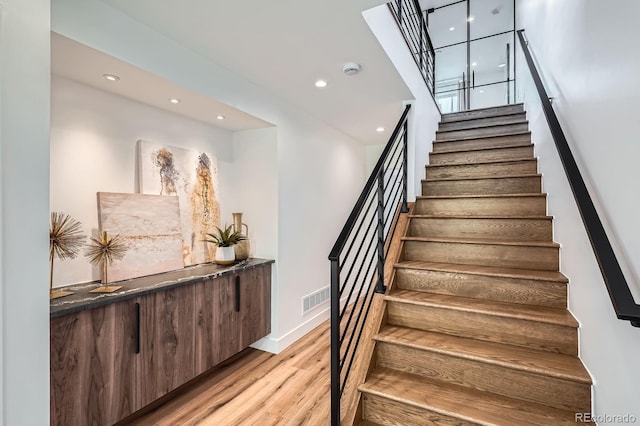 4474 Utica St, Denver, CO 80212 - stairs with wood finished floors and recessed lighting