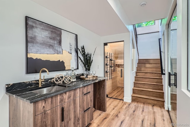 4474 Utica St, Denver, CO 80212 - indoor wet bar featuring light wood-style floors and stairway