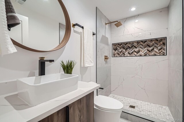4474 Utica St, Denver, CO 80212 - full bathroom featuring tiled shower and vanity