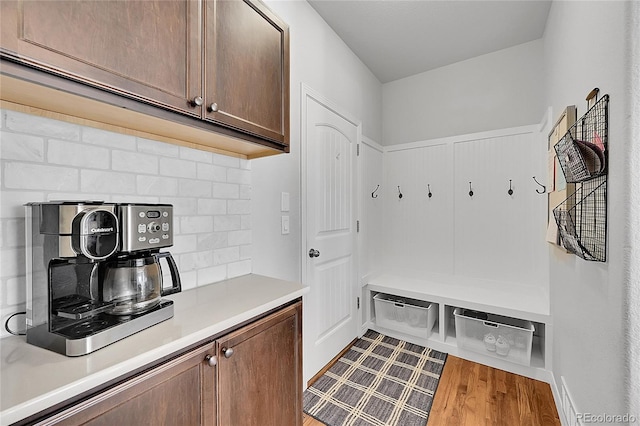 mudroom with light hardwood / wood-style floors