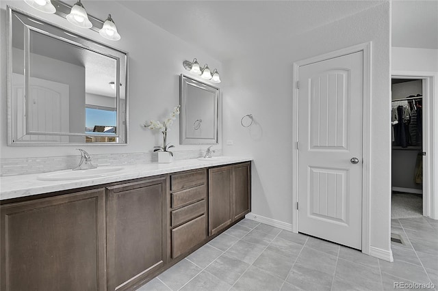 bathroom with vanity and tile patterned flooring