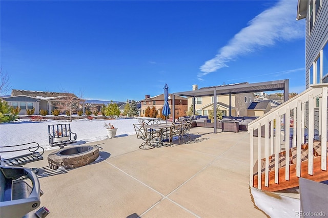 view of patio featuring an outdoor living space with a fire pit