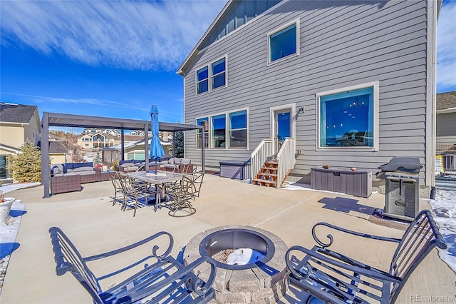 view of patio / terrace with an outdoor living space with a fire pit