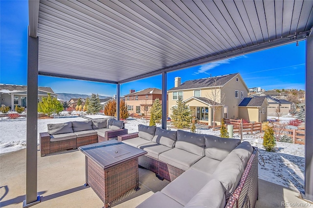 snow covered patio with outdoor lounge area