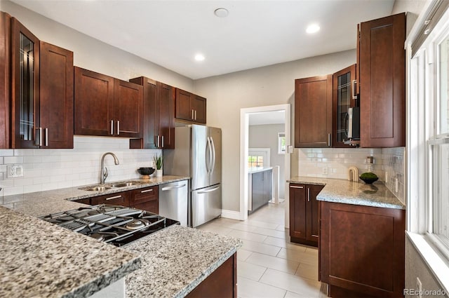 1532 Meade St, Denver, CO 80204 - kitchen with a sink, stainless steel appliances, light stone counters, glass insert cabinets, and tasteful backsplash