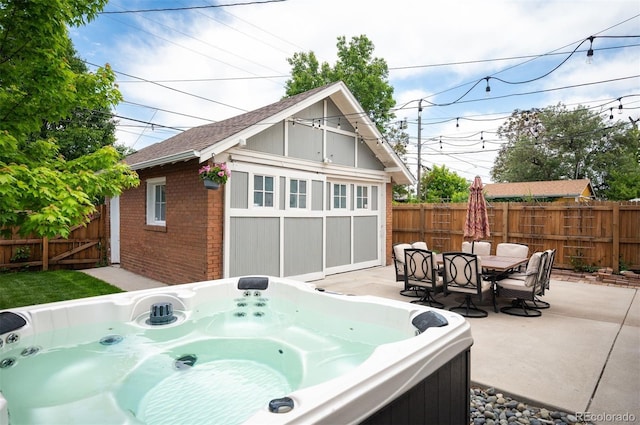 1532 Meade St, Denver, CO 80204 - fenced backyard featuring a hot tub, a patio area, an outbuilding, and outdoor dining area