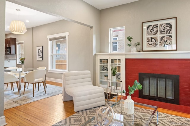 1532 Meade St, Denver, CO 80204 - living room with wood finished floors, a fireplace, recessed lighting, and baseboards