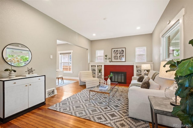 1532 Meade St, Denver, CO 80204 - living room with wood finished floors, baseboards, a fireplace, and recessed lighting