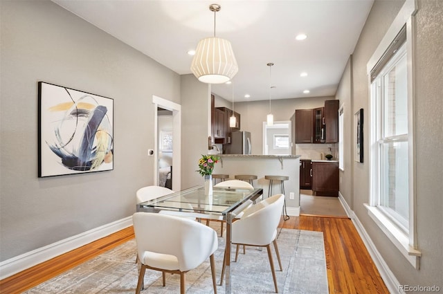 1532 Meade St, Denver, CO 80204 - dining space featuring light wood finished floors, recessed lighting, and baseboards