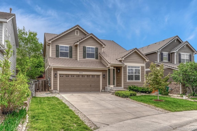 traditional-style home featuring a tiled roof, concrete driveway, and an attached garage