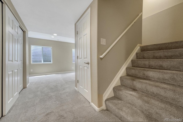stairway with carpet, baseboards, and recessed lighting