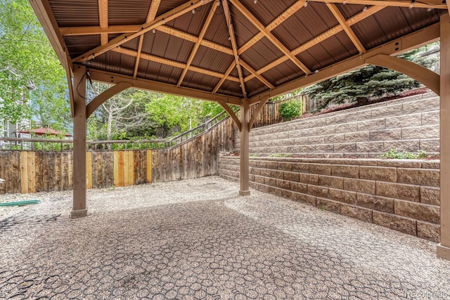 view of patio with a gazebo and fence