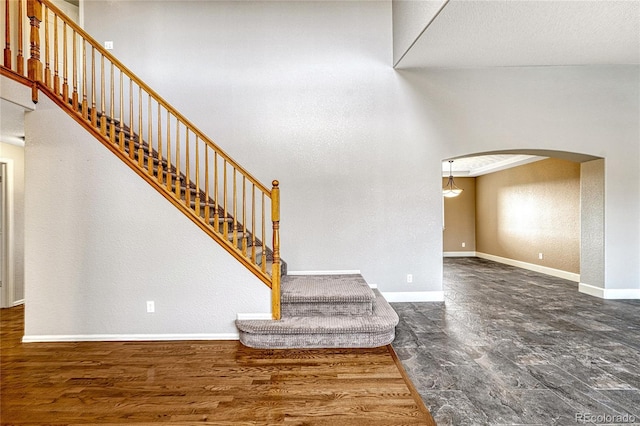 stairway featuring hardwood / wood-style flooring