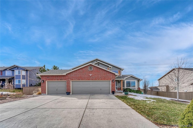 view of front of property with a garage and a front lawn