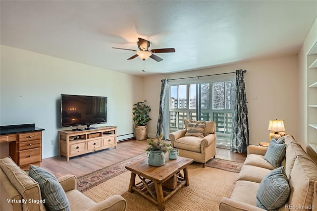 9335 E Center Ave Unit 7B, Denver, CO 80247 - living area with a baseboard radiator, a ceiling fan, and light wood-type flooring