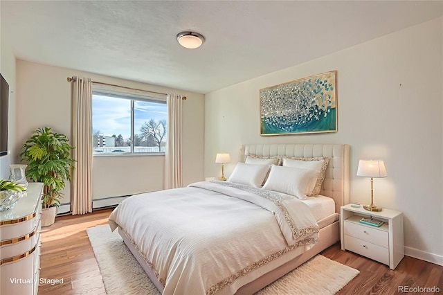 9335 E Center Ave Unit 7B, Denver, CO 80247 - bedroom featuring wood finished floors and baseboards