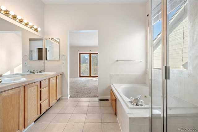 274 W Willowick Cir, Highlands Ranch, CO 80129 - bathroom with double vanity, a whirlpool tub, tile patterned floors, and a stall shower