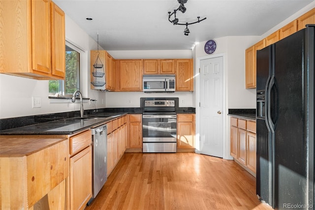 274 W Willowick Cir, Highlands Ranch, CO 80129 - kitchen with stainless steel appliances and light wood-style flooring
