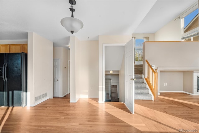 274 W Willowick Cir, Highlands Ranch, CO 80129 - unfurnished living room featuring stairway and light wood finished floors