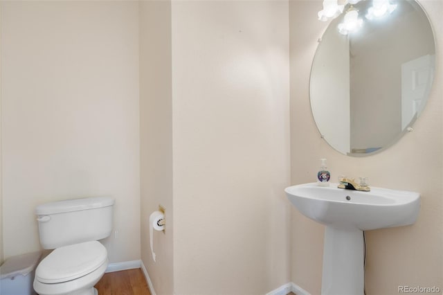274 W Willowick Cir, Highlands Ranch, CO 80129 - half bathroom with toilet and wood finished floors