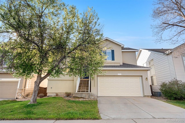 274 W Willowick Cir, Highlands Ranch, CO 80129 - view of front of home featuring stucco siding, concrete driveway, stairs, a front yard, and an attached garage