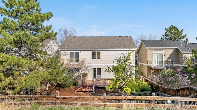 274 W Willowick Cir, Highlands Ranch, CO 80129 - back of property featuring a fenced backyard and a balcony