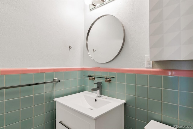 bathroom with wainscoting and vanity