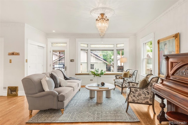 506 N Marion St, Denver, CO 80218 - living area with wood finished floors, a chandelier, ornamental molding, and baseboards