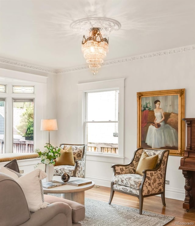 506 N Marion St, Denver, CO 80218 - living room featuring healthy amount of natural light, a chandelier, wood finished floors, and baseboards