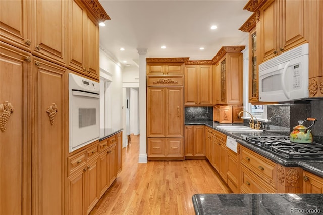 506 N Marion St, Denver, CO 80218 - kitchen with white appliances, a sink, light wood-style flooring, backsplash, and recessed lighting