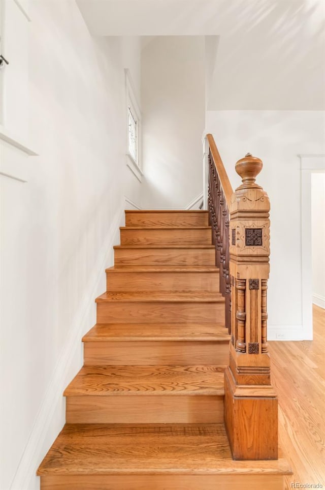506 N Marion St, Denver, CO 80218 - staircase featuring wood finished floors and baseboards