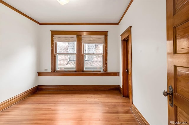 506 N Marion St, Denver, CO 80218 - spare room featuring crown molding, light wood finished floors, and baseboards