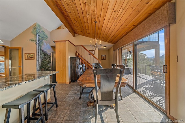 dining space with wood ceiling, stairway, vaulted ceiling, dark tile patterned floors, and a notable chandelier