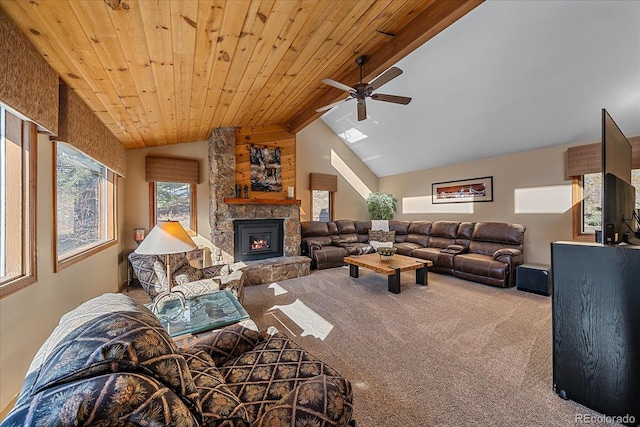 living room with vaulted ceiling with beams, a fireplace, carpet flooring, wood ceiling, and a ceiling fan