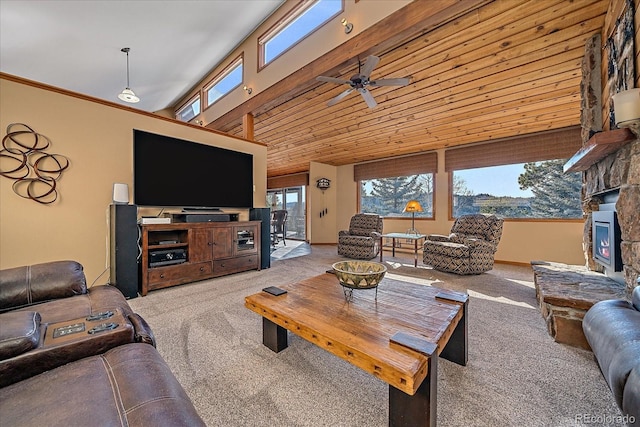 living room featuring a ceiling fan, wood ceiling, ornamental molding, carpet flooring, and a stone fireplace