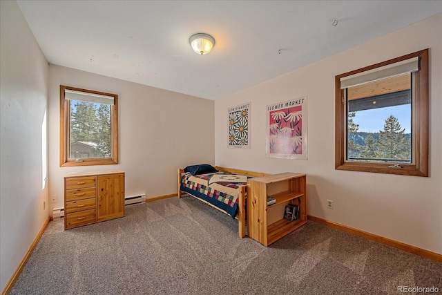 bedroom featuring carpet, baseboards, and baseboard heating