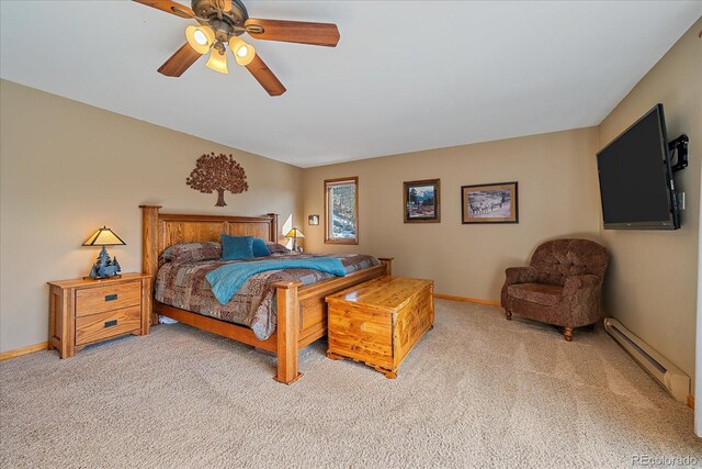 bedroom featuring light carpet, baseboards, a baseboard heating unit, and a ceiling fan