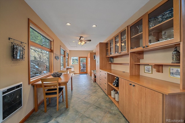 dining area with recessed lighting, baseboards, ceiling fan, and heating unit