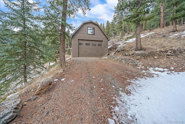 detached garage featuring driveway