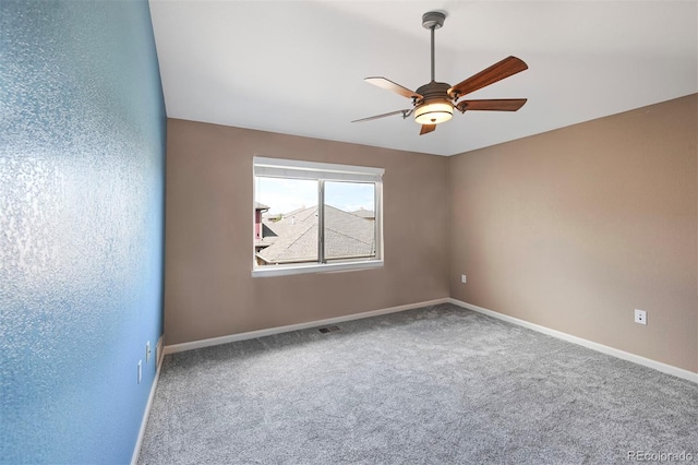unfurnished room with baseboards, carpet, and ceiling fan