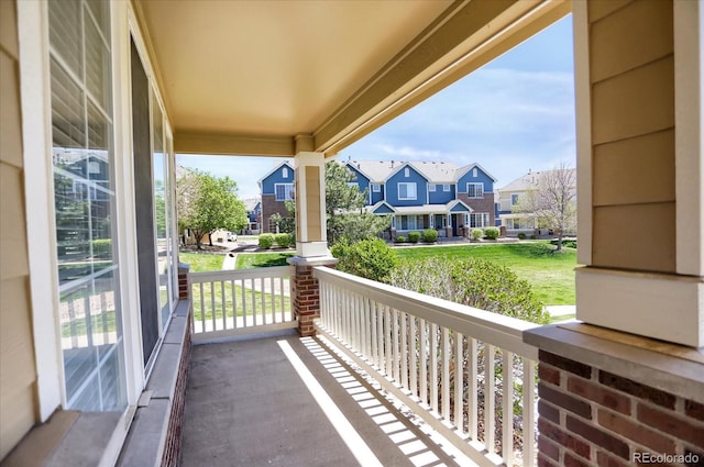 16062 E Geddes Dr Unit 150, Aurora, CO 80016 - balcony featuring covered porch and a residential view
