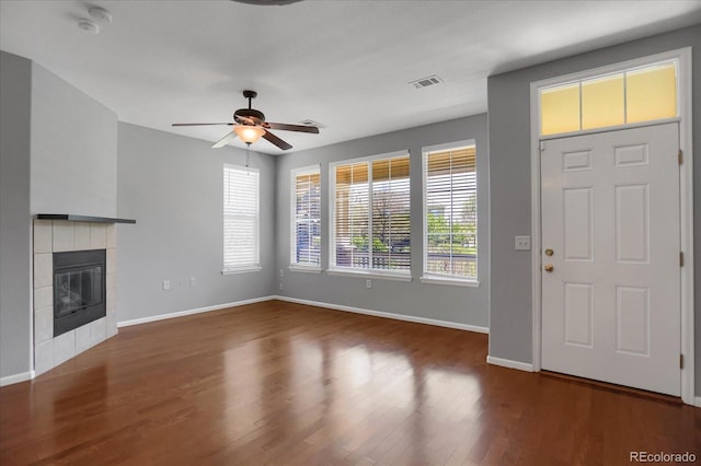16062 E Geddes Dr Unit 150, Aurora, CO 80016 - unfurnished living room with baseboards, a ceiling fan, wood finished floors, and a tile fireplace