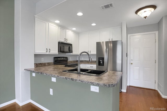 16062 E Geddes Dr Unit 150, Aurora, CO 80016 - kitchen featuring black appliances, a sink, dark wood finished floors, white cabinets, and recessed lighting