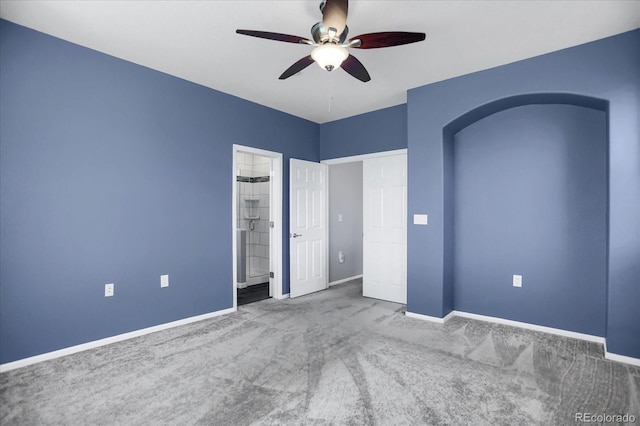 16062 E Geddes Dr Unit 150, Aurora, CO 80016 - unfurnished bedroom with carpet floors, baseboards, arched walkways, and a ceiling fan