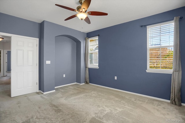 16062 E Geddes Dr Unit 150, Aurora, CO 80016 - unfurnished room featuring ceiling fan, carpet, plenty of natural light, and arched walkways