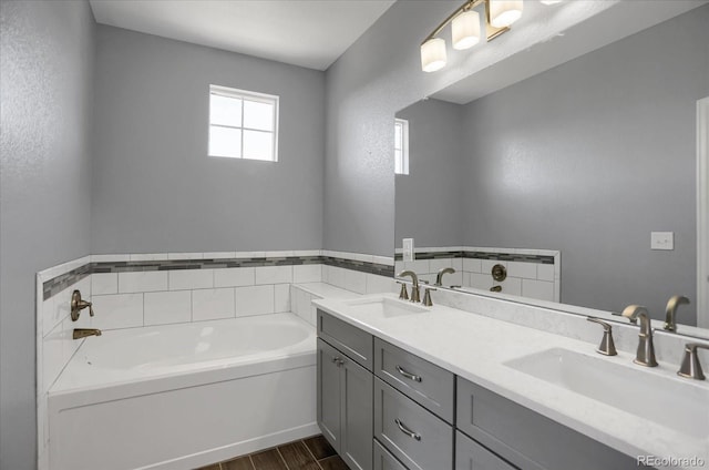 16062 E Geddes Dr Unit 150, Aurora, CO 80016 - bathroom featuring wood finished floors, a bath, and double vanity